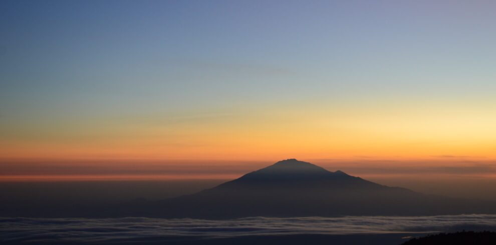 silhouette of mountains during sunset